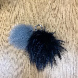 Michael Kors Small and Large fluff ball.